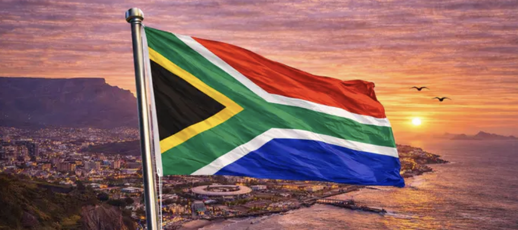 South Africa countryside with flag in forefront