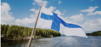 Finland flag over water and some land